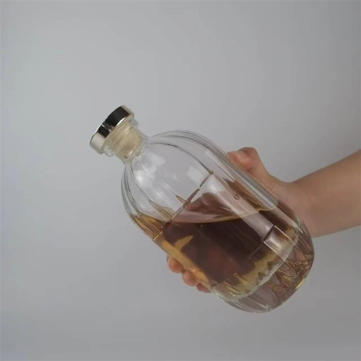 Þykkt botn sporöskjulaga gler áfengisflaska með T loki